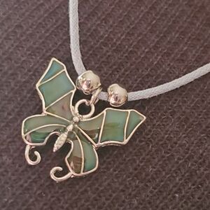 Cool Jewels boho 90s vibes butterfly necklace on gray cord